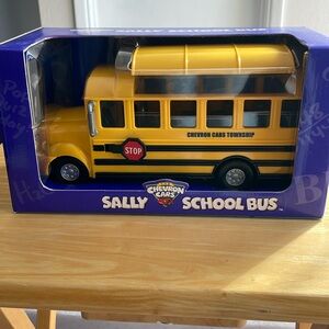 2001 NIB Chevron Sally School Bus Plastic Yellow Collectible Model Car